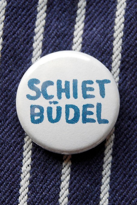 Button, Shietbüdel
